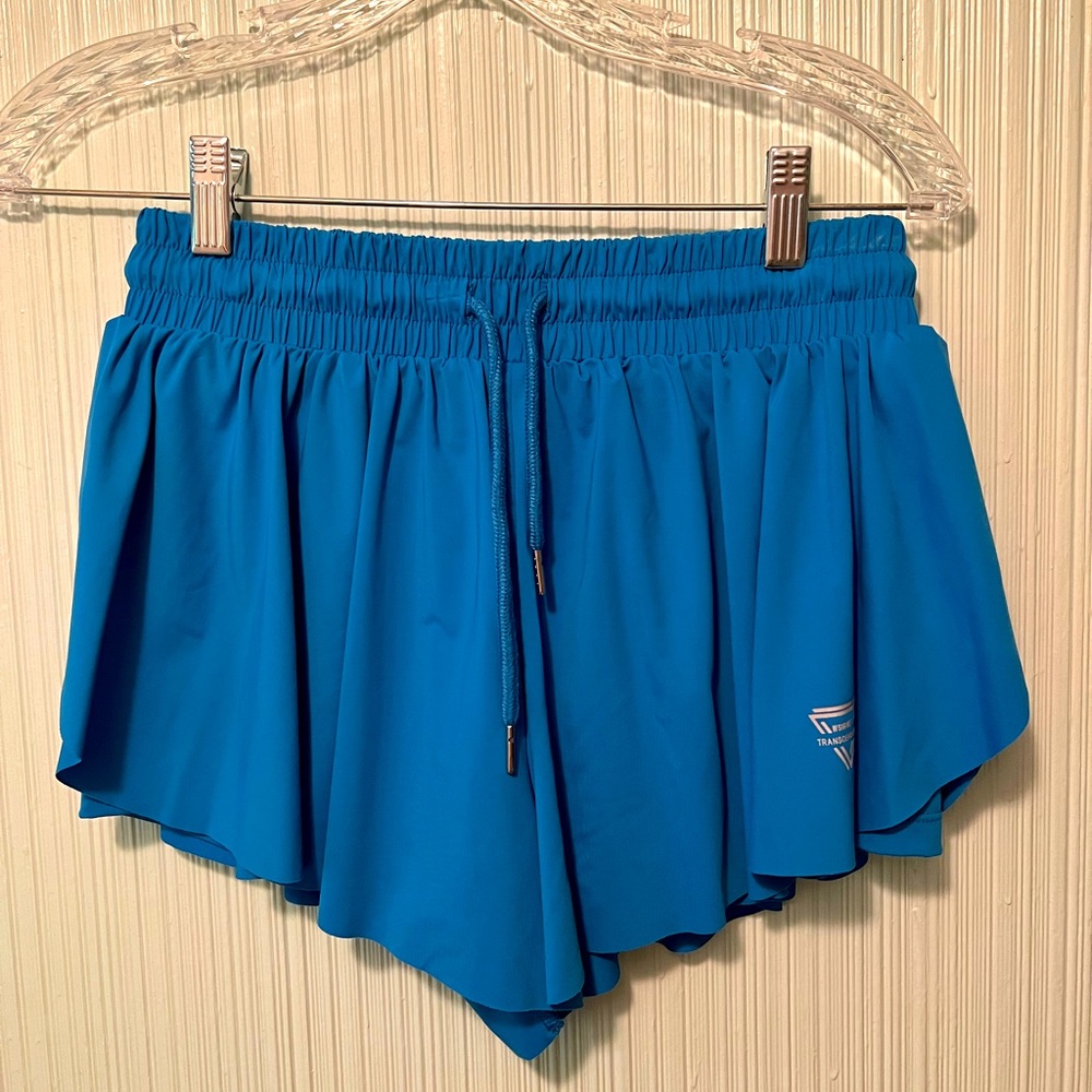 86%nylon 14%spandex, skirt with side slit, built in shorts